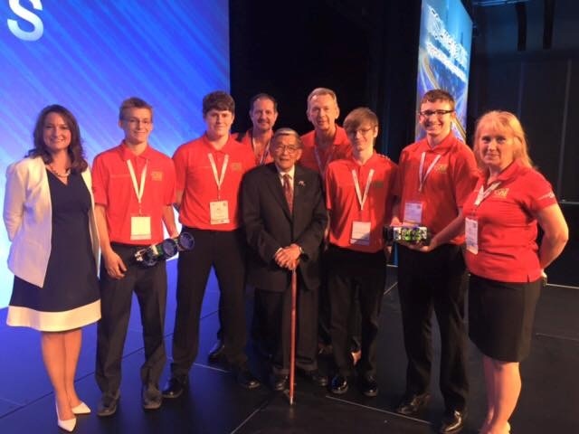 Elaina Farnsworth with youth automotive program team